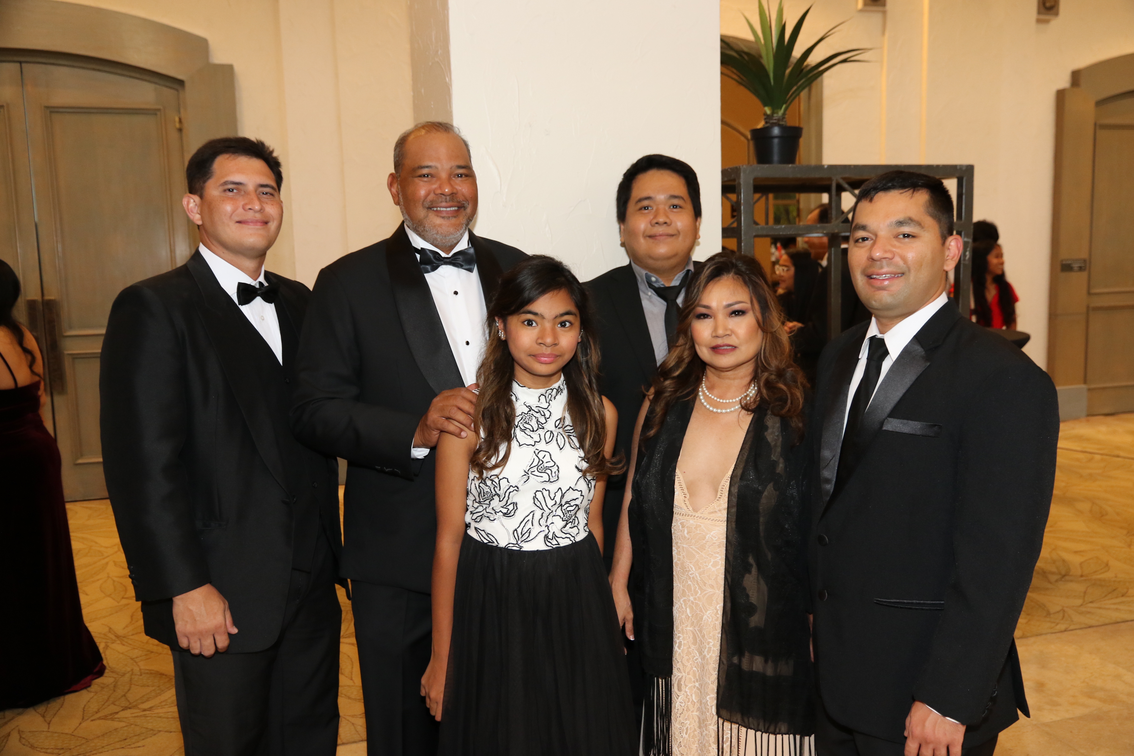 (left rear) Camilo Lorenzo, account executive with Matson Navigation Co.; Nominee Frank A. Cruz, vice president and general manager; Mark Corcuera, Guam training manager, both with Guam Fast Foods Inc. which does business as KFC; and (from left front) Isabella F. Cruz; Erika S. Cruz, deputy superintendent of operations for the Guam Department of Education and wife of Frank; and Frankie C. Cruz.