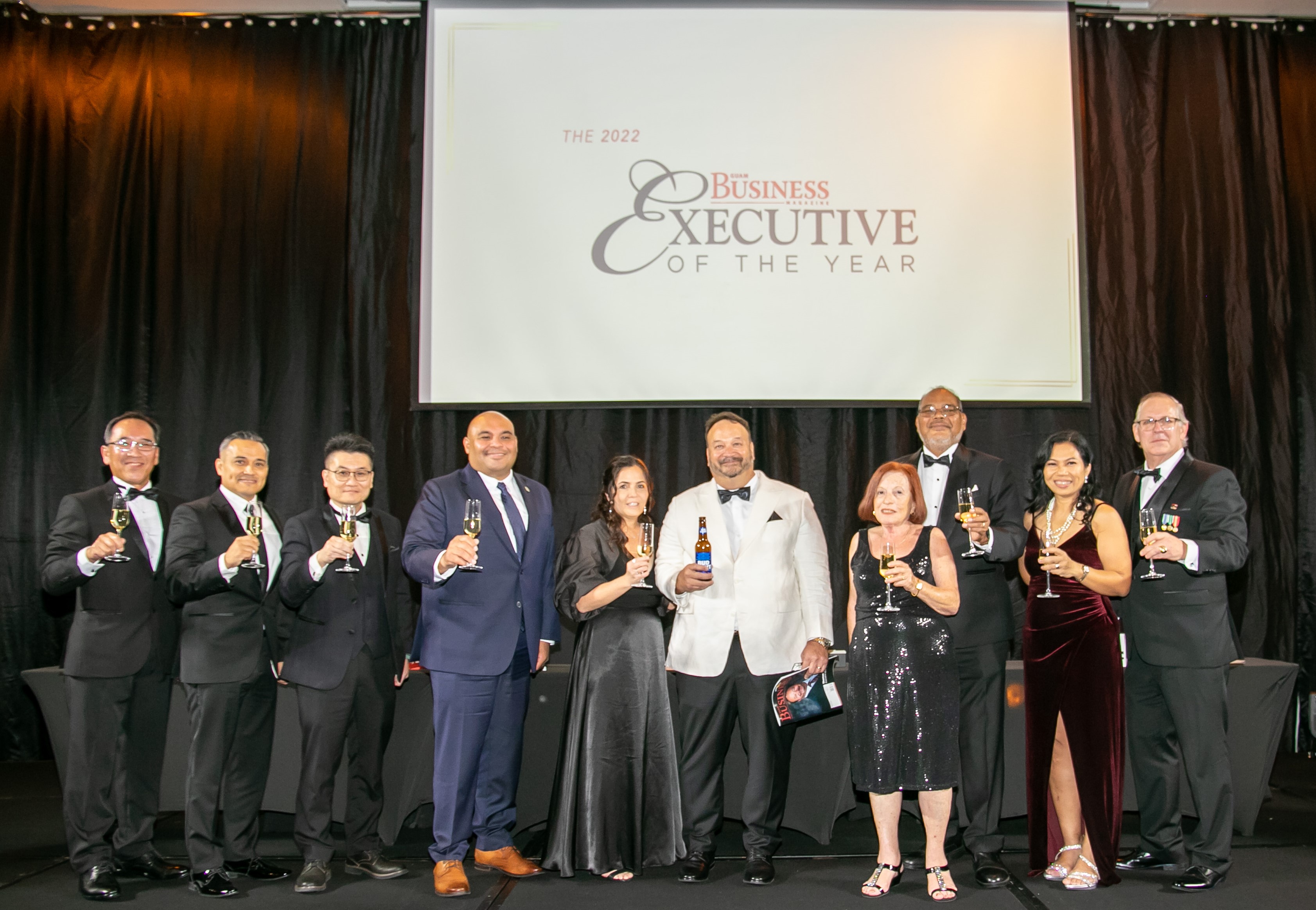 For the champagne toast to 2022 Guam Business Magazine Executive of the Year Thomas G. Shimizu, general manager, Ambros Inc., Marianas Pacific Distributors Inc., Shimbros International Inc., South Pacific Distributors Inc. were (from left) Ken Yanagisawa, general manager, The Tsubaki Tower; general manager, Hotel Nikko Guam; General manager for Guam-Micronesia region for American President Lines; CEO and co-founder Bella Wings Aviation LLC; CEO and founder, Guam Gift Baskets; Jimmy T.C. Hau, pre