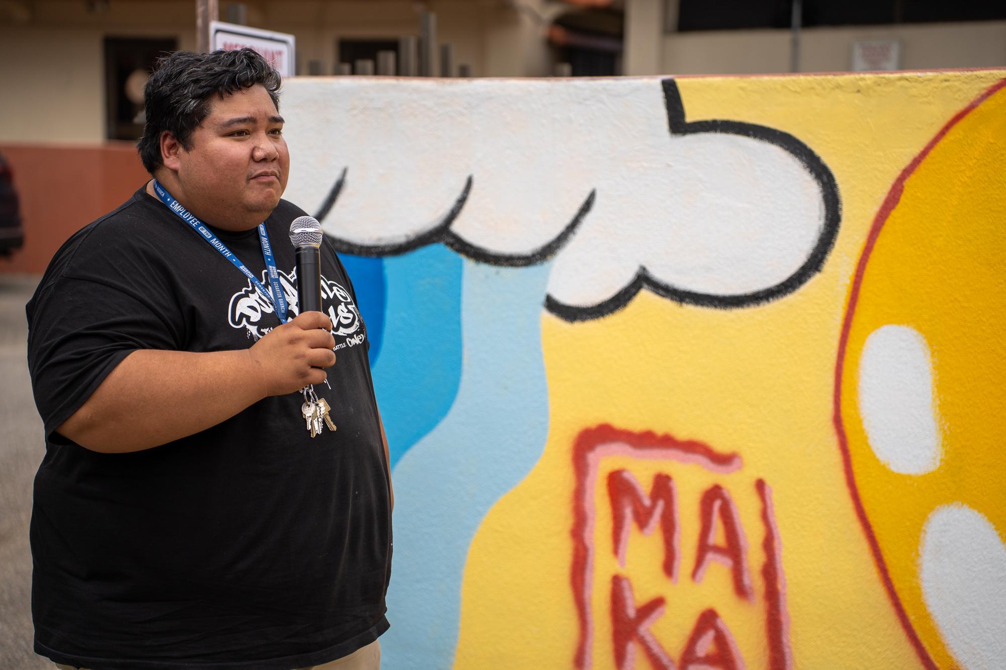 Kamakanui’aha’ ilono Pilialoha Aquino, muralist. Photo by Skyler Obispo. 