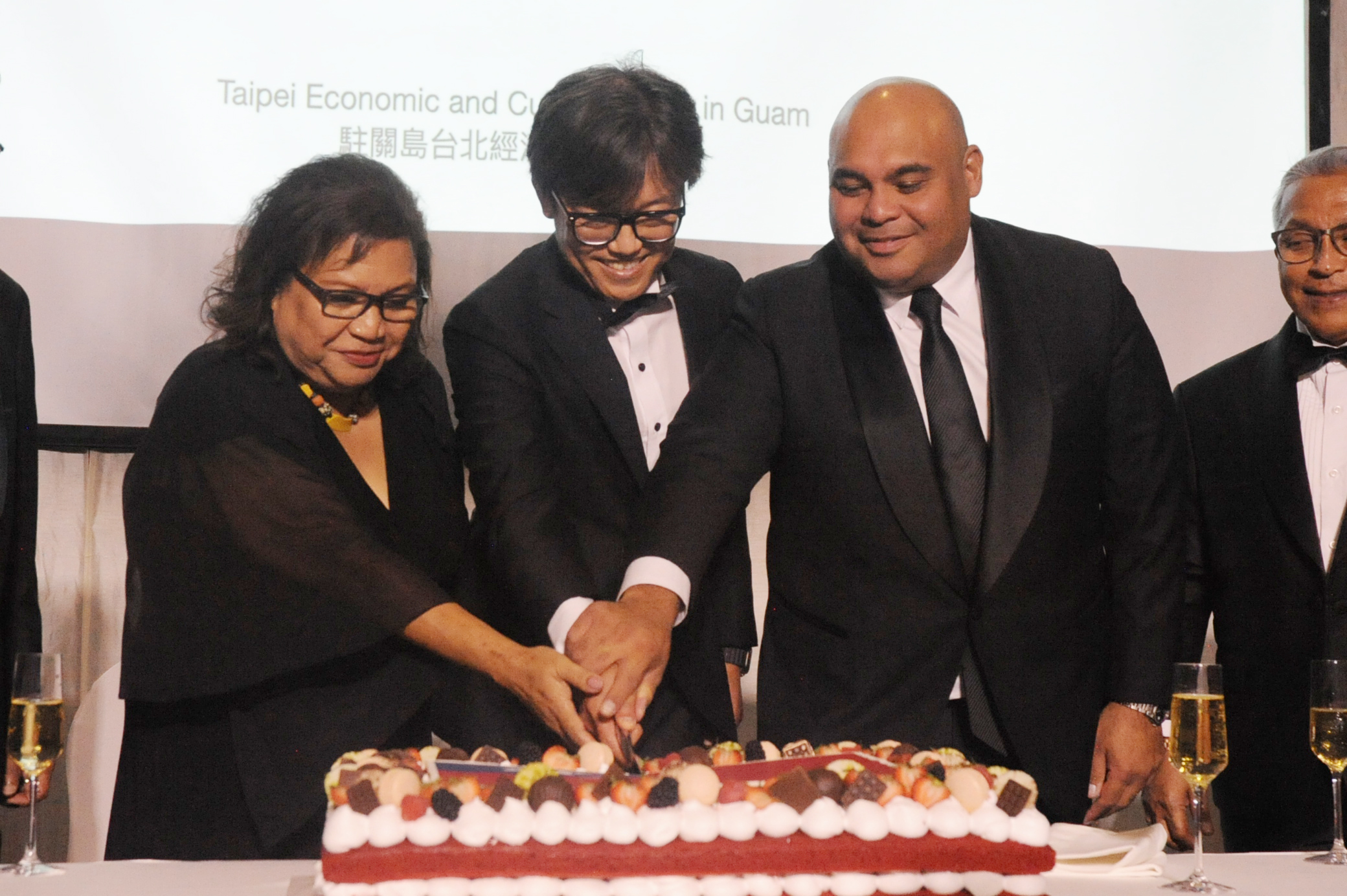 Cutting the cake were (from left) Vice president of Palau J. Uduch Sengebau Sr.; Paul Yin-lien Chen, director general of TECO; and  Lt. Gov. Joshua F. Tenorio.