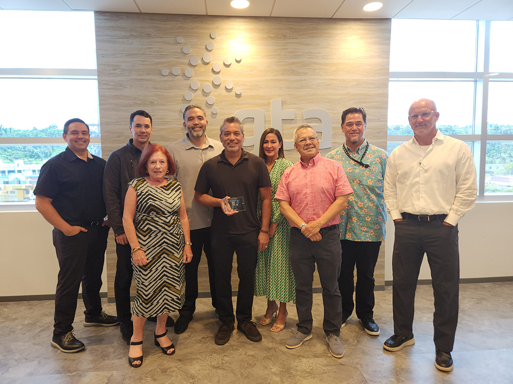 (From left back row) Cook; Jon Nathan Denight, vice president of marketing; Joseph Shinohara, chief financial officer; Stacy C. Elarmo, vice president of people operations; and Andrew M. Gayle, chief operating officer; all with GTA; and (from left front row) Maratita; Roland Certez, president; Daniel J. Tydingco, executive vice president for legal and regulatory; both with GTA; and John. 