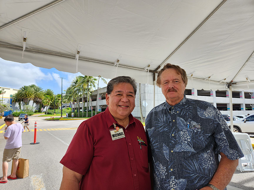 (From left) Michael Borja, Mangilao store manager and Philip Schrage, senior vice president and leasing manager for Micronesia Mall.