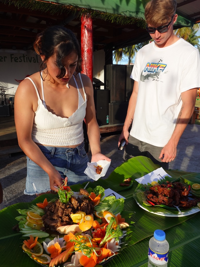 Visitors sample the entries in the Estafao (spicy beef stew) Cooking Contest on Feb. 17, 2024, at the 20th Annual Tinian Hot Pepper Festival in The Marianas.